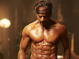 Guy tags SRK and asks,”Sir, how long did it take you to get this physique?” King Khan responds